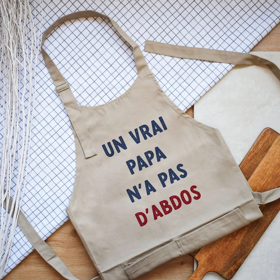 Juste Un T-shirt Tabliers Un vrai papa n'a pas d'abdos tablier humour papa